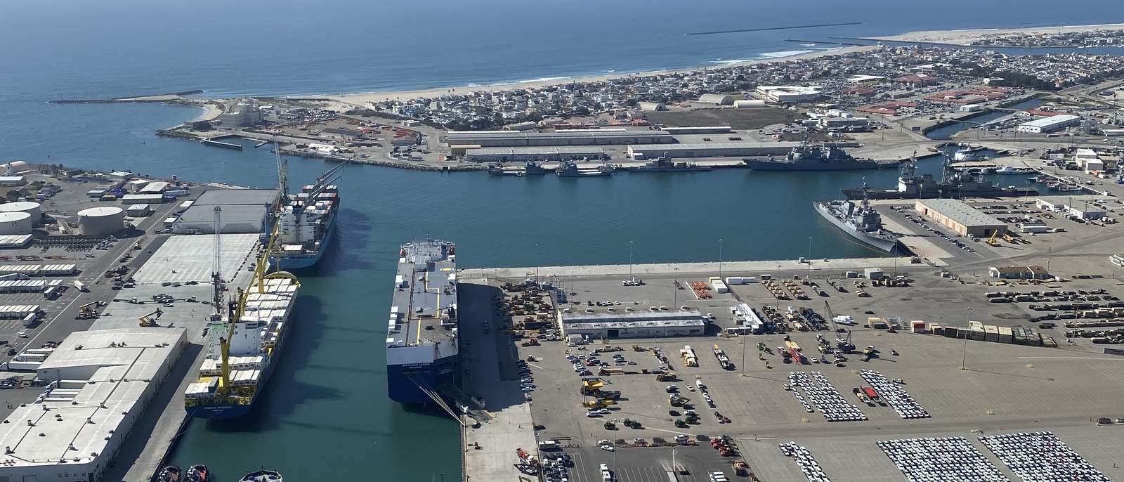 Aerial view of a United States deep-water port, cargo vessels at berth alongside marshalling yards